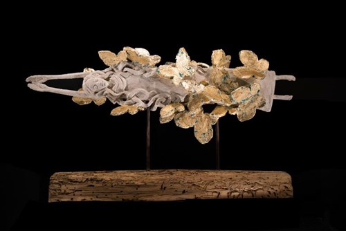 Living room sculpture by Adam Kołakowski titled Golden-Feathered Girl
