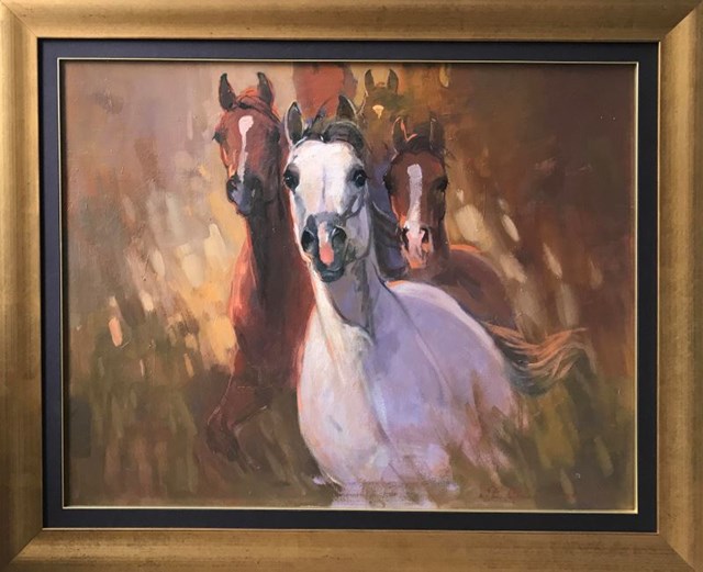 Living room painting by Stanisław Chomiczewski titled 3 horses