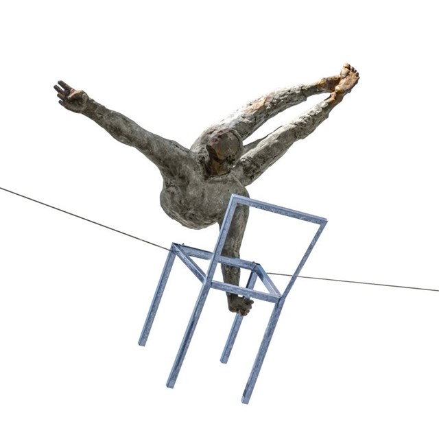 Living room sculpture by Jerzy Kędziora titled Acrobat with a chair