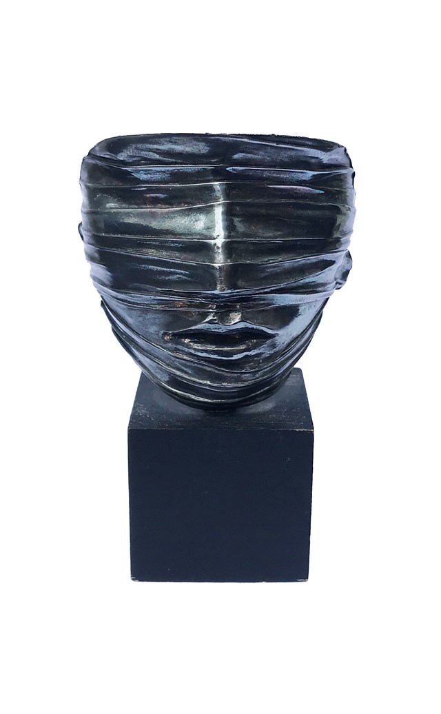 Living room sculpture by Igor Mitoraj titled Face